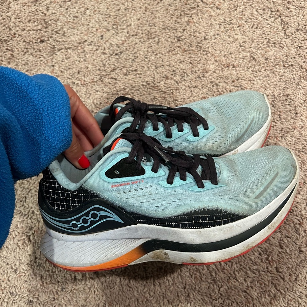 Saucony Women's Light Blue and Black Running Shoes with Orange Accents